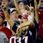 A New England Patriots fan cheers during the second half of an NFL football game against the Arizona Cardinals, Sunday, Sept. 11, 2016, in Glendale, Ariz. (AP Photo/Ross D. Franklin)