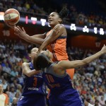 Connecticut Sun's Alyssa Thomas goes up to the basket as Phoenix Mercury's Diana Taurasi (3) and Lindsey Harding (10) defend during the first half of a WNBA basketball game, Friday, Sept. 2, 2016, in Uncasville, Conn. (AP Photo/Jessica Hill)