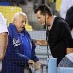Actor Charlie Sheen, right, talks with former Los Angeles Dodgers manager Tommy Lasorda during a baseball game between the Dodgers and the Arizona Diamondbacks, Tuesday, Sept. 6, 2016, in Los Angeles. (AP Photo/Mark J. Terrill)
