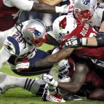 New England Patriots running back LeGarrette Blount (29) fumbles as Arizona Cardinals defensive end Calais Campbell, bottom, recovers during the second half of an NFL football game, Sunday, Sept. 11, 2016, in Glendale, Ariz. (AP Photo/Ross D. Franklin)