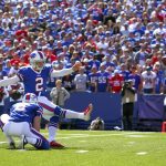 Buffalo Bills kicker Dan Carpenter (2) kicks a field goal off the hold Colton Schmidt (6) during the first half of an NFL football game against the Arizona Cardinals on Sunday, Sept. 25, 2016, in Orchard Park, N.Y. (AP Photo/Bill Wippert)