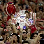Fans stand during the national anthem prior to  an NFL football game between the New England Patriots and the Arizona Cardinals, Sunday, Sept. 11, 2016, in Glendale, Ariz. (AP Photo/Rick Scuteri)