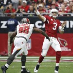 Arizona Cardinals quarterback Carson Palmer (3) throws under pressure from Tampa Bay Buccaneers defensive tackle Clinton McDonald (98) during the first half of an NFL football game, Sunday, Sept. 18, 2016, in Glendale, Ariz. (AP Photo/Ross D. Franklin)