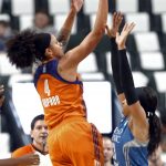 Phoenix Mercury's Candice Dupree, left, shoots over Minnesota Lynx's Maya Moore in the first quarter of a WNBA playoff semi-finals basketball game Wednesday, Sept. 28, 2016, in St. Paul, Minn. (AP Photo/Jim Mone)