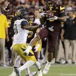Arizona State's DJ Calhoun (3) catches an on-side kick and returns it for a touchdown as California's Raymond Davison (31) defends during the second half of an NCAA college football game, Saturday, Sept. 24, 2016, in Tempe, Ariz. Arizona State won 51-41. (AP Photo/Matt York)