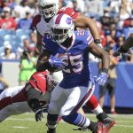 Buffalo Bills running back LeSean McCoy (25) runs away from Arizona Cardinals nose tackle Josh Mauro (97) and defensive tackle Corey Peters (98) during the first half of an NFL football game on Sunday, Sept. 25, 2016, in Orchard Park, N.Y. (AP Photo/Jeffrey T. Barnes)