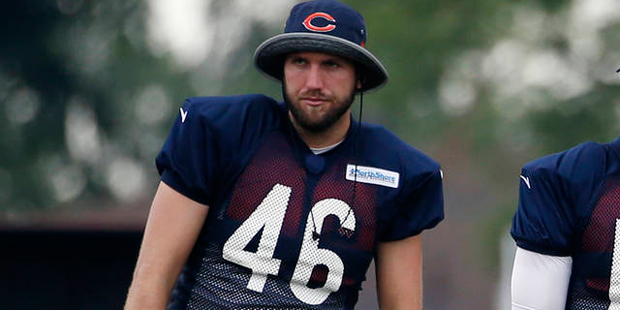 Chicago Bears' Aaron Brewer watches teammates during practice at the NFL football teams training ca...