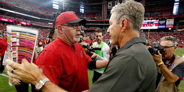 Arizona Cardinals head coach Bruce Arians, left, greets Tampa Bay Buccaneers head coach Dirk Koette...