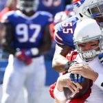 Arizona Cardinals quarterback Carson Palmer (3) is sacked by Buffalo Bills outside linebackers Jerry Hughes (55) and Lorenzo Alexander during the first half of an NFL football game on Sunday, Sept. 25, 2016, in Orchard Park, N.Y. (AP Photo/Bill Wippert)