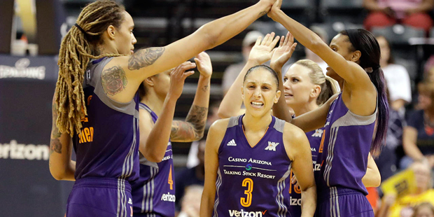 Phoenix Mercury's Diana Taurasi (3) walks to the bench as teammates celebrate after a timeout by th...