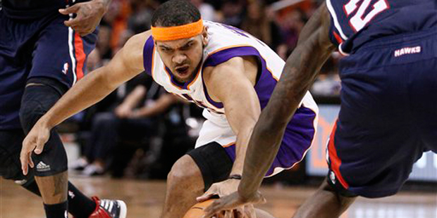 Phoenix Suns' Jared Dudley chases down the loose ball against the Atlanta Hawks during the second h...