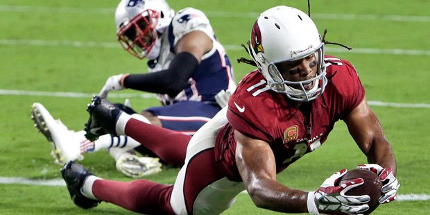 Arizona Cardinals wide receiver Larry Fitzgerald (11) scores a touchdown as New England Patriots co...