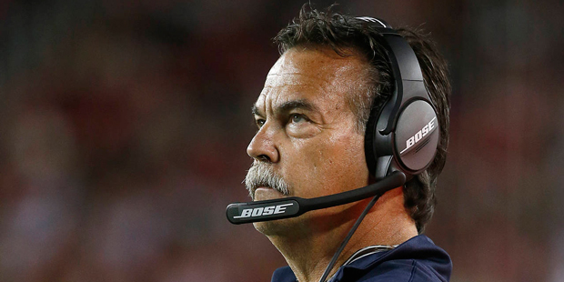 Los Angeles Rams head coach Jeff Fisher watches during the second half of an NFL football game agai...