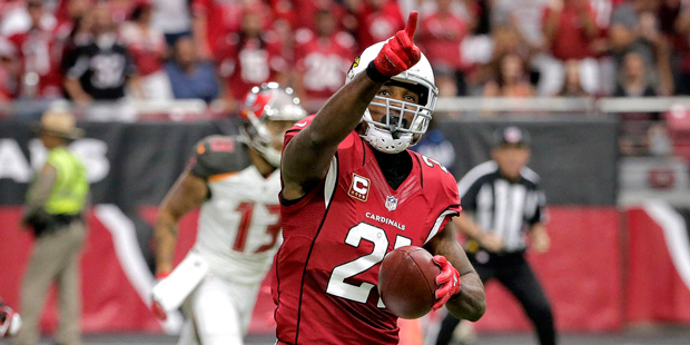 Arizona Cardinals cornerback Patrick Peterson (21) points to the stands after intercepting a pass a...
