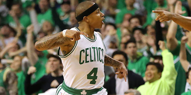 Boston Celtics guard Isaiah Thomas reacts to hitting a 3-pointer against the Atlanta Hawks during t...