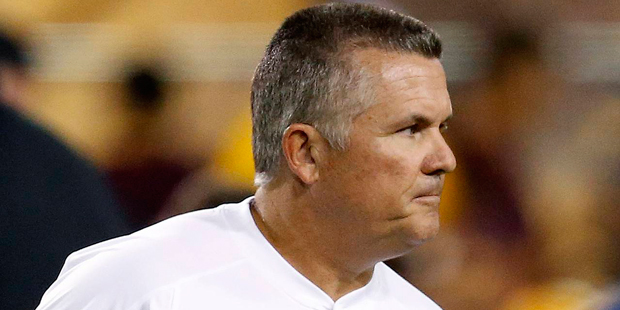 Arizona State coach Todd Graham watches his players warm up for an NCAA college football game again...