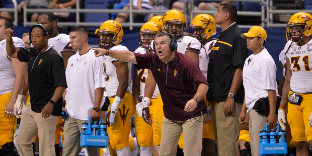 Arizona State head coach Todd Graham, center, yells to his players during the second half of an NCA...