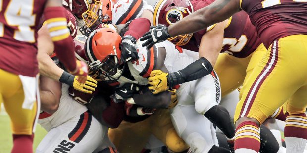 Cleveland Browns running back Isaiah Crowell, center, lunges to score a touchdown during the first ...