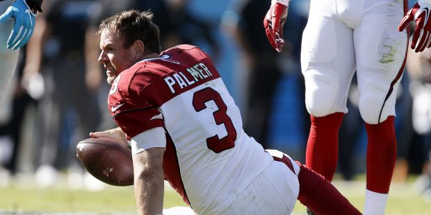 Arizona Cardinals' Carson Palmer (3) looks back after being sacked by the Carolina Panthers in the ...