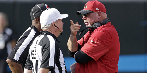 Arizona Cardinals' head coach Bruce Arians talks with NFL officials from the sidelines during the s...