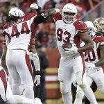 Arizona Cardinals defensive end Calais Campbell (93) celebrates with outside linebacker Markus Golden (44) after intercepting a pass against the San Francisco 49ers during the first half of an NFL football game in Santa Clara, Calif., Thursday, Oct. 6, 2016. (AP Photo/Marcio Jose Sanchez)