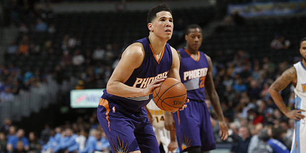 Phoenix Suns guard Devin Booker (1) in the first half of an NBA basketball game Thursday, March 10,...
