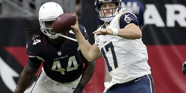 Los Angeles Rams quarterback Case Keenum (17) throws as Arizona Cardinals outside linebacker Markus...