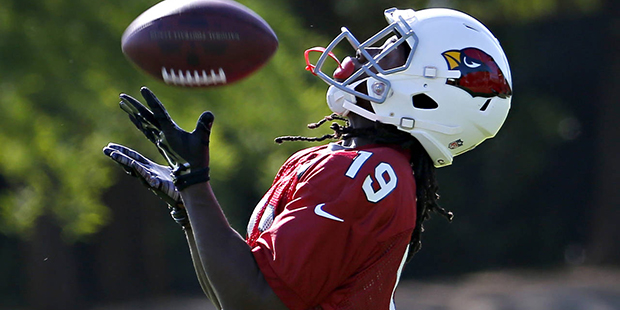 Arizona Cardinals' Chris Hubert works on a drill  during NFL football practice, Tuesday, May 24, 20...