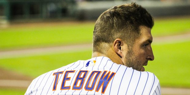 Scottsdale Scorpions outfielder Tim Tebow watches from the dugout during the team’s matchup again...
