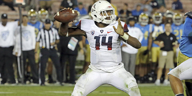 Arizona backup quarterback Khalil Tate (14) sets to pass against UCLA in the second half of an NCAA...