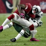 Arizona Cardinals running back David Johnson is tackled by New York Jets cornerback Darrelle Revis (24), rear,during the second half of an NFL football game, Monday, Oct. 17, 2016, in Glendale, Ariz. (AP Photo/Rick Scuteri)