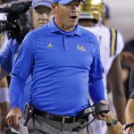 UCLA head coach Jim Mora shouts at officials during the first half of an NCAA college football game against Arizona State on Saturday, Oct. 8, 2016, in Tempe, Ariz. (AP Photo/Ross D. Franklin)