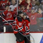 New Jersey Devils center Pavel Zacha (37) and left wing Taylor Hall (9) celebrate a goal by Hall against the Arizona Coyotes during the second period of an NHL hockey game, Tuesday, Oct. 25, 2016, in Newark, N.J. (AP Photo/Julie Jacobson)
