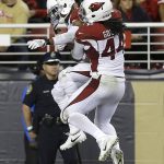 Arizona Cardinals defensive back Marcus Cooper, left, celebrates with outside linebacker Markus Golden (44) after Cooper intercepted a pass during the second half of an NFL football game against the San Francisco 49ers in Santa Clara, Calif., Thursday, Oct. 6, 2016. (AP Photo/Ben Margot)