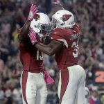 Arizona Cardinals running back David Johnson (31) celebrates his touchdown with teammate Jaron Brown (13) during the second half of an NFL football game against the New York Jets, Monday, Oct. 17, 2016, in Glendale, Ariz. (AP Photo/Rick Scuteri)