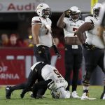 Arizona State quarterback Manny Wilkins (5) stays on the ground after being sacked during the first half of an NCAA college football game against Southern California Saturday, Oct. 1, 2016, in Los Angeles. (AP Photo/Ryan Kang)