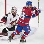 Arizona Coyotes goaltender Louis Domingue is scored on by Montreal Canadiens' Alexei Emelin (not shown) as Canadiens' Andrew Shaw reacts during the first period of an NHL hockey game, Thursday, Oct. 20, 2016 in Montreal.  (Graham Hughes/The Canadian Press via AP)