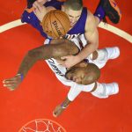 Phoenix Suns center Alex Len, top, of Ukraine, and Los Angeles Clippers center Marreese Speights reach for a rebound during the first half of an NBA basketball game, Monday, Oct. 31, 2016, in Los Angeles. (AP Photo/Mark J. Terrill)