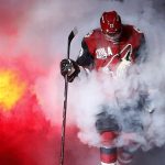 Arizona Coyotes' Oliver Ekman-Larsson emerges from the smoke during player introductions prior to an NHL hockey game against the Philadelphia Flyers on Saturday, Oct. 15, 2016, in Glendale, Ariz. The Coyotes defeated the Flyers 4-3 in overtime. (AP Photo/Ross D. Franklin)