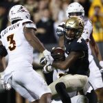 Colorado wide receiver Bryce Bobo, front right, is pulled down after catching a pass for a long gain by Arizona State defensive back Armand Perry, behind Bobo, as Arizona State linebackers DJ Calhoun, front left, and Marcus Ball, back, look on in the first half of an NCAA college football game Saturday, Oct. 15, 2016, in Boulder, Colo. (AP Photo/David Zalubowski)