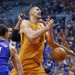 Phoenix Suns center Alex Len (21) gets the ball stripped by Golden State Warriors guard Klay Thompson (11) during the second half of an NBA basketball game Sunday, Oct. 30, 2016, in Phoenix. The Warriors defeated the Suns 106-100. (AP Photo/Ross D. Franklin)