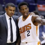 Phoenix Suns' Eric Bledsoe (2) talks with head coach Earl Watson during the first half of an NBA preseason basketball game against the San Antonio Spurs on Monday, Oct. 3, 2016, in Phoenix. The Suns won 91-86. (AP Photo/Ross D. Franklin)