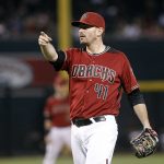 Arizona Diamondbacks pitcher Daniel Hudson motions for a video replay on an apparent go-ahead home run by San Diego Padres' Ryan Schimpf during the ninth inning of a baseball game, Sunday, Oct. 2, 2016, in Phoenix. The call on the field of a home run was overturned. (AP Photo/Ralph Freso)