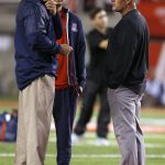 Arizona coach Rich Rodriguez, left, talks with Utah coach Kyle Whittingham, right, before an NCAA college football game, Saturday, Oct. 8, 2016, in Salt Lake City. (AP Photo/George Frey)p