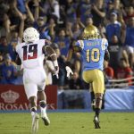 UCLA wide receiver Kenneth Walker III carries a pass in for a touchdown as outruns Arizona'a DaVonte' Neal pursuit during the first half of an NCAA college football game Saturday, Oct. 1, 2016, in Pasadena, Calif. (AP Photo/Reed Saxon)