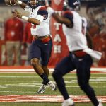 Arizona quarterback Brandon Dawkins (13) throws a touchdown pass on the first play of the night from scrimmage, to wide receiver Shun Brown (6) during an NCAA college football game against Utah, Saturday, Oct. 8, 2016, in Salt Lake City. (AP Photo/George Frey)