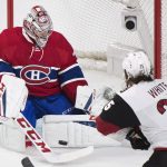 Montreal Canadiens goaltender Carey Price makes a save against Arizona Coyotes' Ryan White during the first period of an NHL hockey game, Thursday, Oct. 20, 2016 in Montreal. (Graham Hughes/The Canadian Press via AP)
