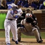Chicago Cubs' Anthony Rizzo hits a RBI single against the Cleveland Indians during the first inning of Game 4 of the Major League Baseball World Series Saturday, Oct. 29, 2016, in Chicago. (AP Photo/Charlie Riedel)