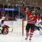 
              New Jersey Devils center Adam Henrique (14) celebrates after scoring a goal against the Arizona Coyotes during the second period of an NHL hockey game, Tuesday, Oct. 25, 2016, in Newark, N.J. (AP Photo/Julie Jacobson)
            