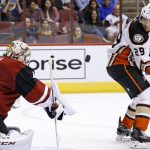 Arizona Coyotes goalie Mike Smith (41) makes a save as Anaheim Ducks' David Jones (29) watches during the first period of a preseason NHL hockey game Saturday, Oct. 1, 2016, in Glendale, Ariz. (AP Photo/Ross D. Franklin)